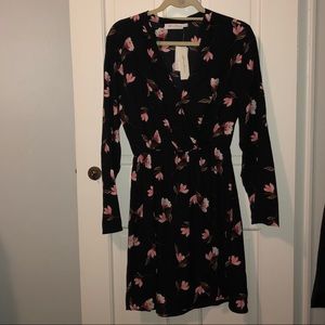 All in Favor black dress with pink floral pattern.